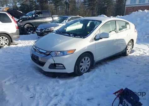 2012 Honda Insight from USA, damaged, VIN JHMZE2H37CS005710